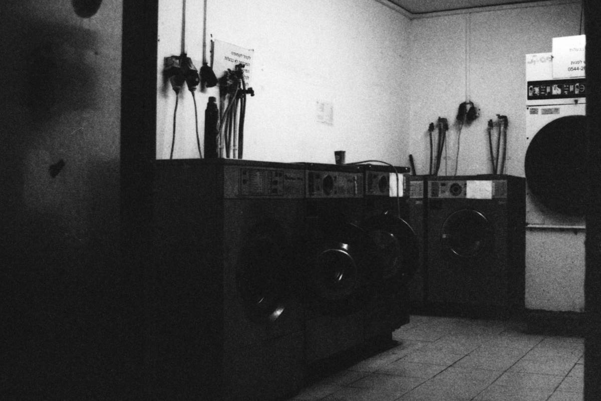 Public Laundry. Camera: Nikon FE. Film: Kodak Tri-X 400 @ 3200. Location: Tel Aviv, Israel.