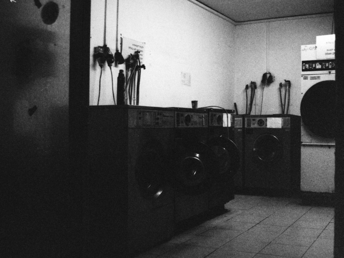 Public Laundry. Camera: Nikon FE. Film: Kodak Tri-X 400 @ 3200. Location: Tel Aviv, Israel.